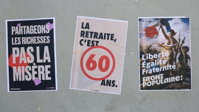 Posters for the French election are seen on a wall