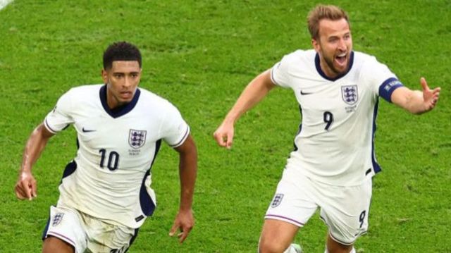 Just Bellingham celebrates his goal against Slovakia during a Euro 2024 clash.  He is running with fellow team mate harry kane