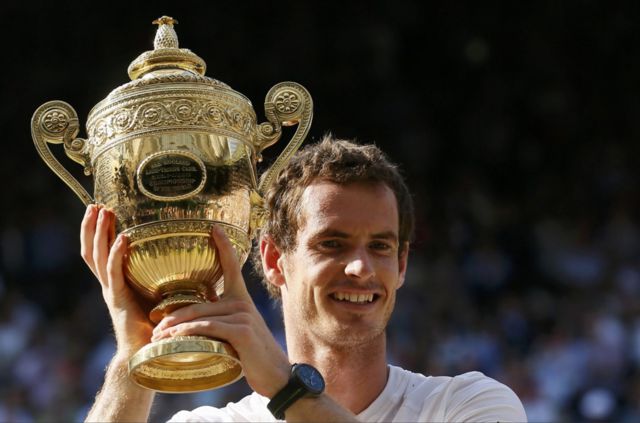 Andy Murray holding the Wimbledon trophy