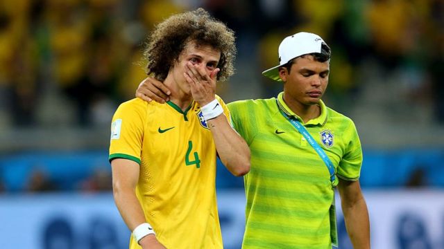 David Luiz is consoled by Thiago Silva