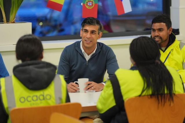 Prime Minister Rishi Sunak speaks to staff during a visit to an Ocado distribution centre.