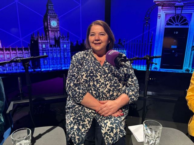 Carlisle Labour candidate Julie Minns sits in the the BBC Cumbria election debate studio wearing a blue and white top
