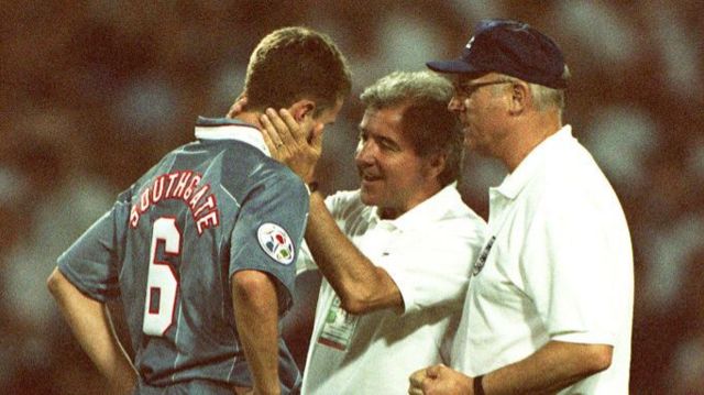 Gareth Southgate is consoled by England manager Terry Venables and coach Don Howe after missing a penalty against Germany at Euro '96