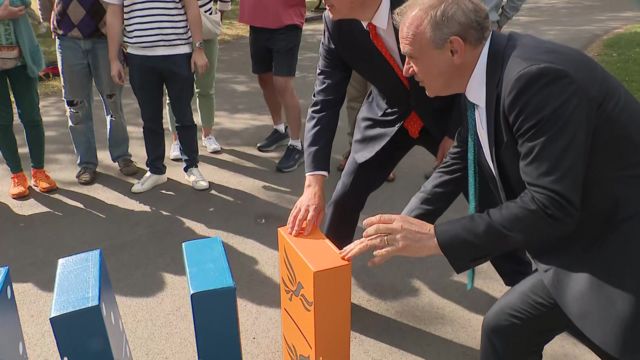 Ed Davey knocks over blue dominoes