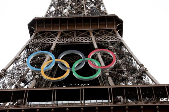 Close up partial image of the Eiffel Tower in Paris with the Olympic rings