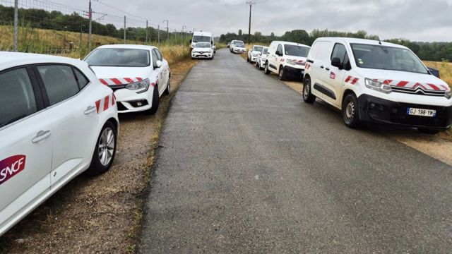 SNCF cars lined up on a country road