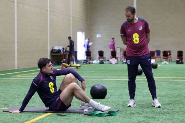 Harry Maguire and Gareth Southgate talking during England training