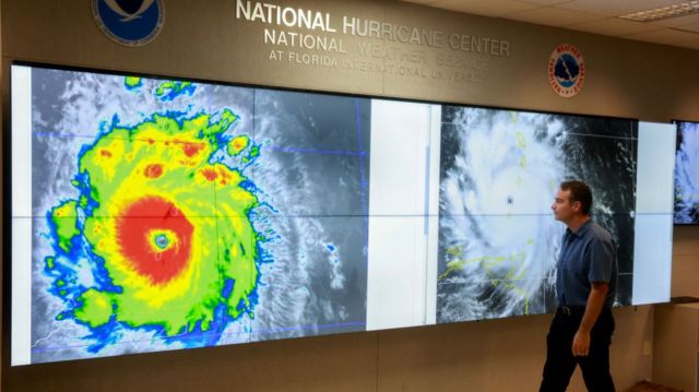 An image of Hurricane Beryl on a screen at the US National Hurricane Research Center