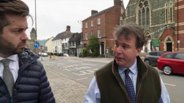 The BBC's Joe Pike questions Craig Williams in the street