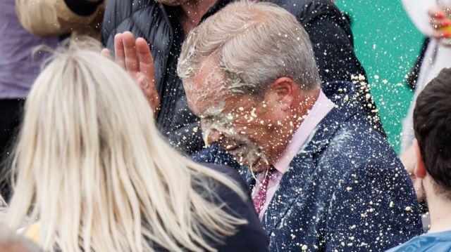 Nigel Farage has a milkshake thrown over him