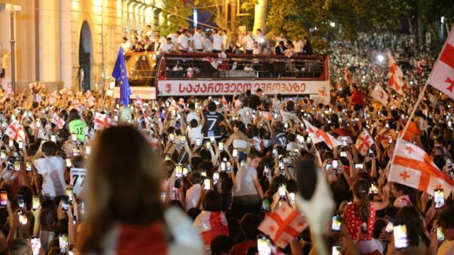 Independence Square in Tbilisi, Georgia where crowds gather to welcome the Georgia players who are parading in an open top bus