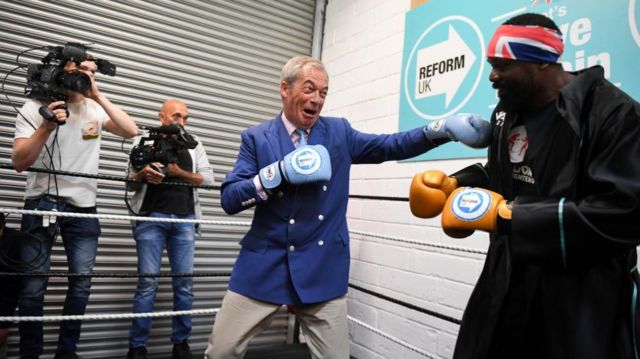 Britain's Reform UK Party Leader Nigel Farage meets with heavyweight boxer Derek Chisora in Clacton