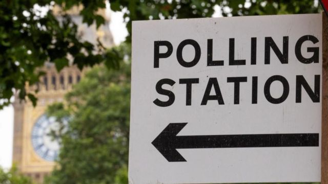 A polling station sign, with Big Ben in the background