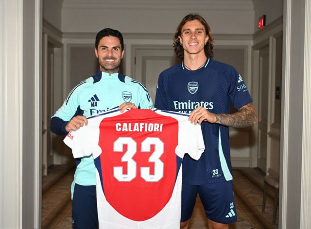 Arsenal manager Mikel Arteta with new signing Riccardo Calafiori