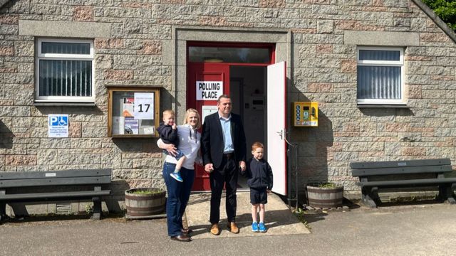 Douglas Ross with his family outside a polling station
