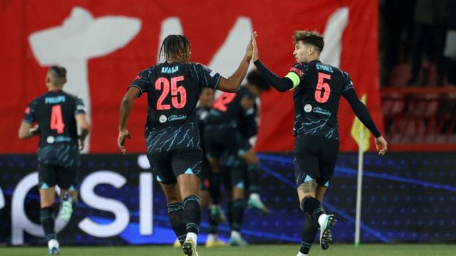 Manuel Akanji and John Stones of Manchester City celebrating their teams first goal during the UEFA Champions League match between FK Crvena zvezda and Manchester City at Stadion Rajko Mitic on December 13, 2023 in Belgrade, Serbia