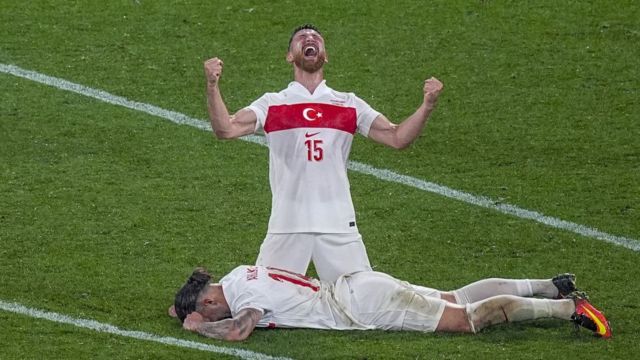 Salih Ozcan (15) of Turkiye celebrates victory with his teammate Abdulkerim Bardakci (F) at the end of the UEFA EURO 2024 round of 16 match between Austria and Turkiye at Football Stadium Leipzig