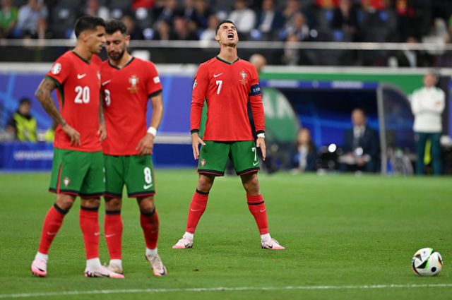 Cristiano Ronaldo of Portugal reacts as he prepares to take a free kick