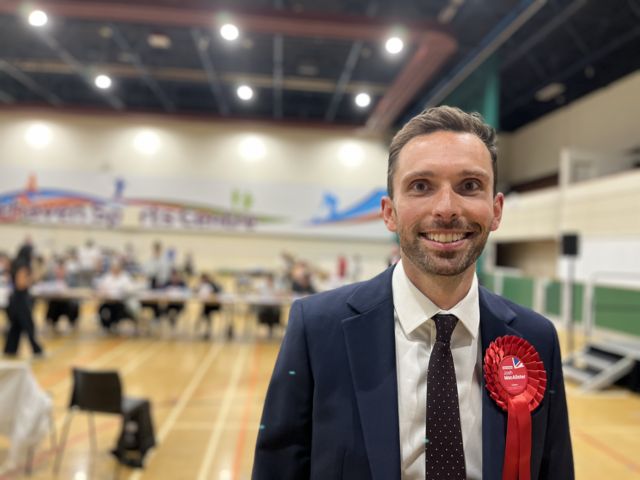 Labour's candidate Josh McAlister smiles as celebrates winning Whitehaven and Workington