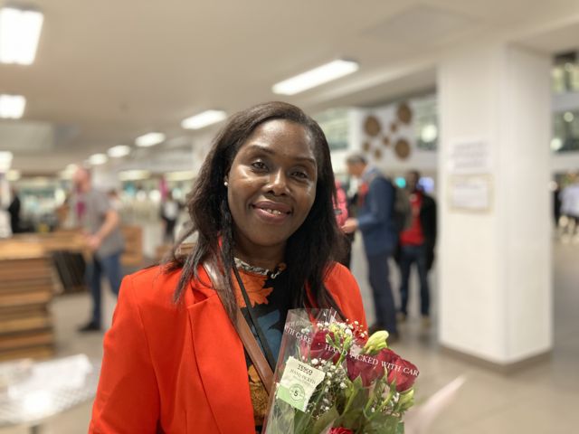 Evelyn Akoto holding roses at the election count
