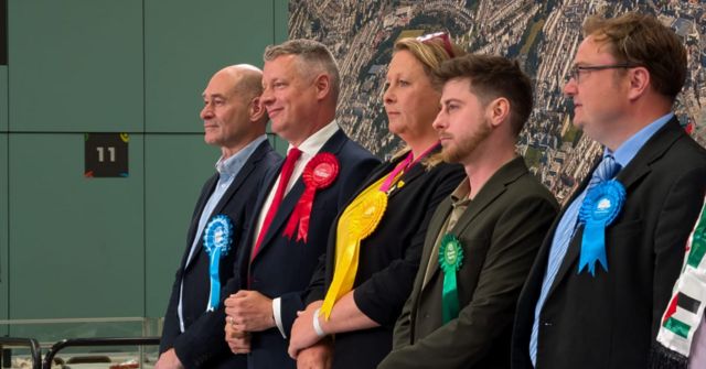 Candidates at an election count in Plymouth