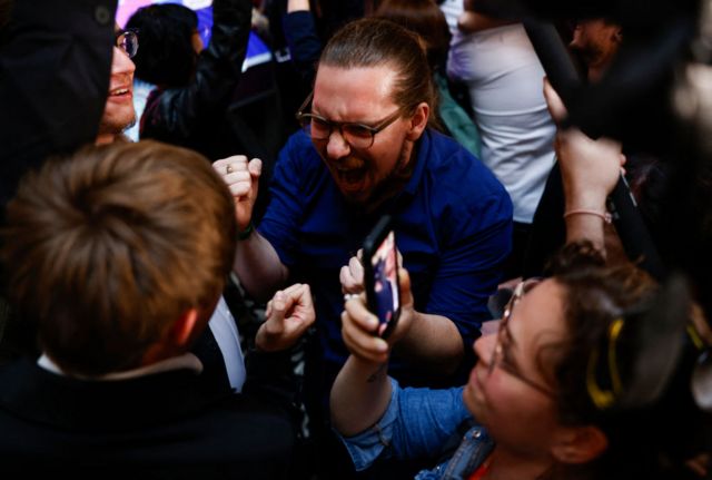 Supporters react during the election night of left-wing party La France Insoumise (LFI) following the first results of the second round of France's legislative election at La Rotonde Stalingrad in Paris on July 7, 2024.