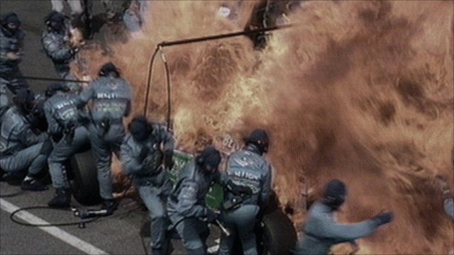 Jos Verstappen's Benetton catches fire during a pit stop