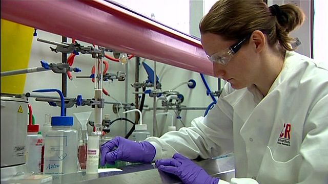 A scientist working on cancer immunology research