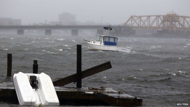 A boat is seen in the rough waters near the Beach Channel section of the Queens borough of New York