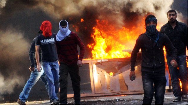 Kurdish demonstrators at burning barricade in Istanbul, 30 Oct 12