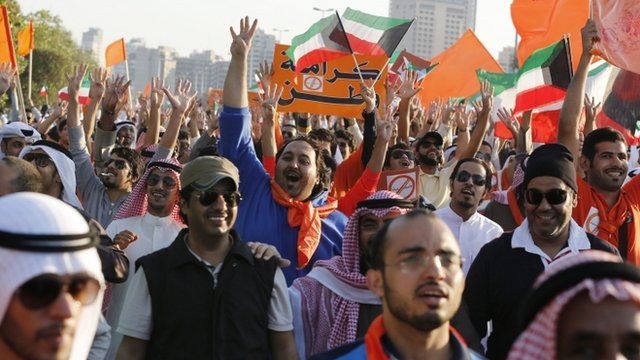 Kuwaiti opposition supporters chant slogans in Kuwait City