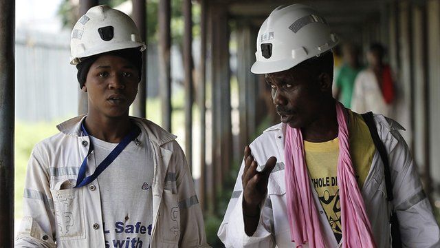 Two miners coming off shift at a mine near Johannesburg, South Africa