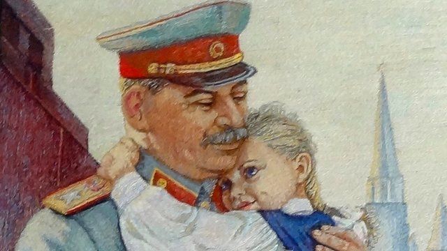 Portrait of Stalin holding little girl, in Gori museum