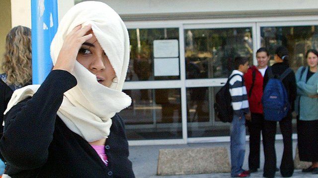 French Muslim girl in headscarf near Lille - file pic