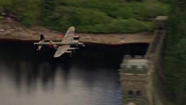RAF Lancaster bomber flying over Derwent Dam
