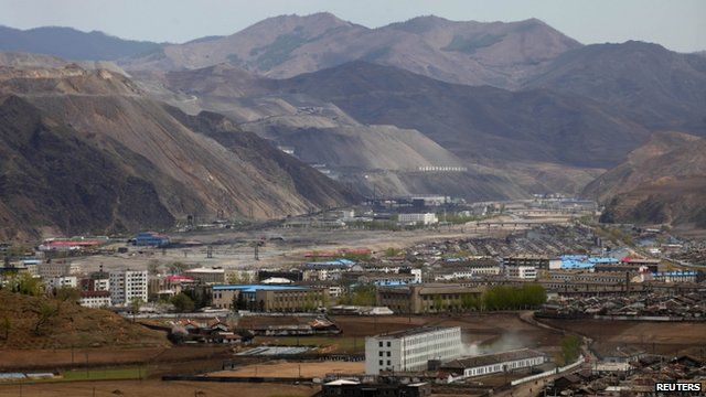 A North Korean iron ore mine (L) is seen near the North Korean town of Musan