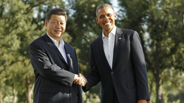 President Xi and President Obama shake hands