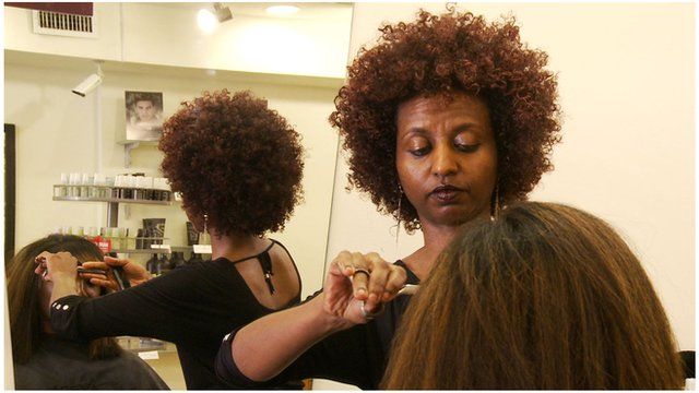 An Ethiopian immigrant hairdresser in a Washington salon