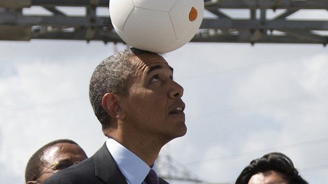 US President Obama balancing "socketball" on his head