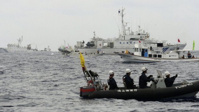 File photo: Japanese Coast Guard vessels, Japanese fishing boats, and a Chinese surveillance ship in the East China Sea near the disputed islands, known as Senkaku in Japan and Diaoyu in China, 26 May 2013