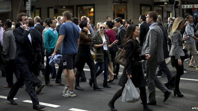 Pedestrians crossing a road in Sydney on June 13, 2013