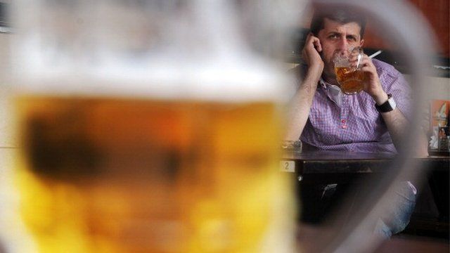 Man drinking a pint of beer
