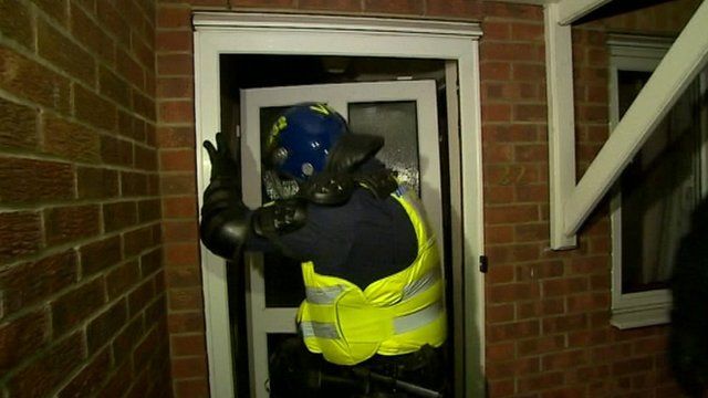 Police officer during raid in Cambridgeshire