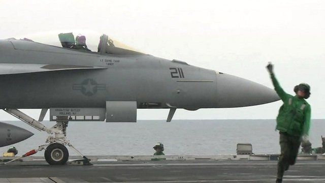 F-18 jet on aircraft carrier