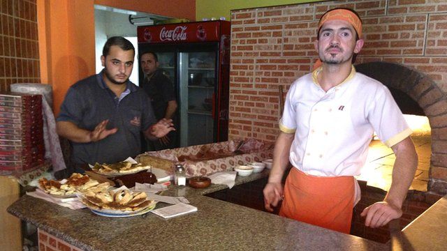 Hamza Issa (left) with Syrian chef