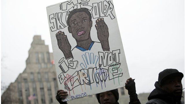 Protestor hold sign against stop-and-frisk policy