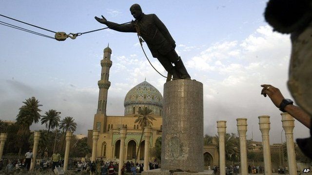 A statue of Saddam Hussein being toppled in Firdaus Square, in downtown Baghdad on April 9, 2003