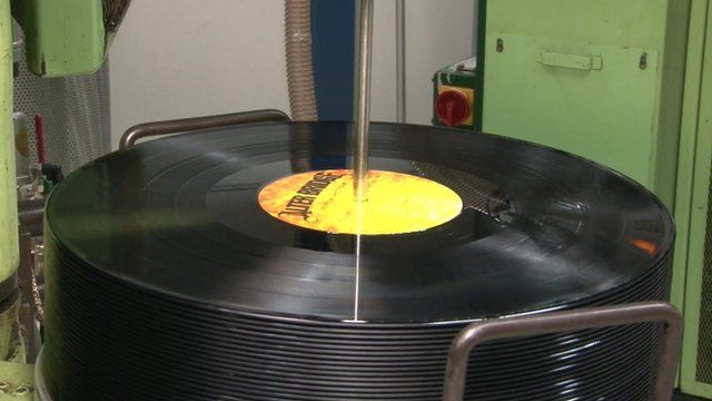 Vinyl records being manufactured