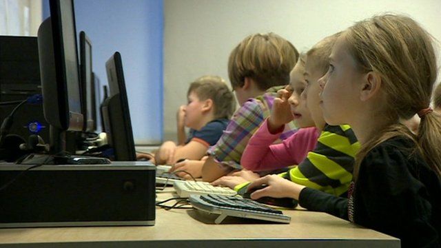 Children look at computer screen