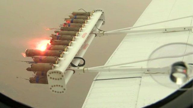 plane releases chemicals to see cloud